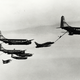 KC-97G Tanker and F-100s flying at a high AoA to allow a meet up with a glorified B-29